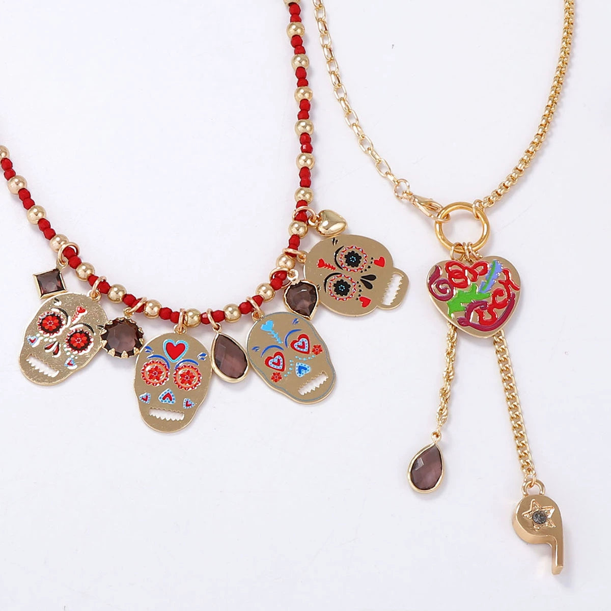 Set of 2 colorful metal skull pendant necklaces